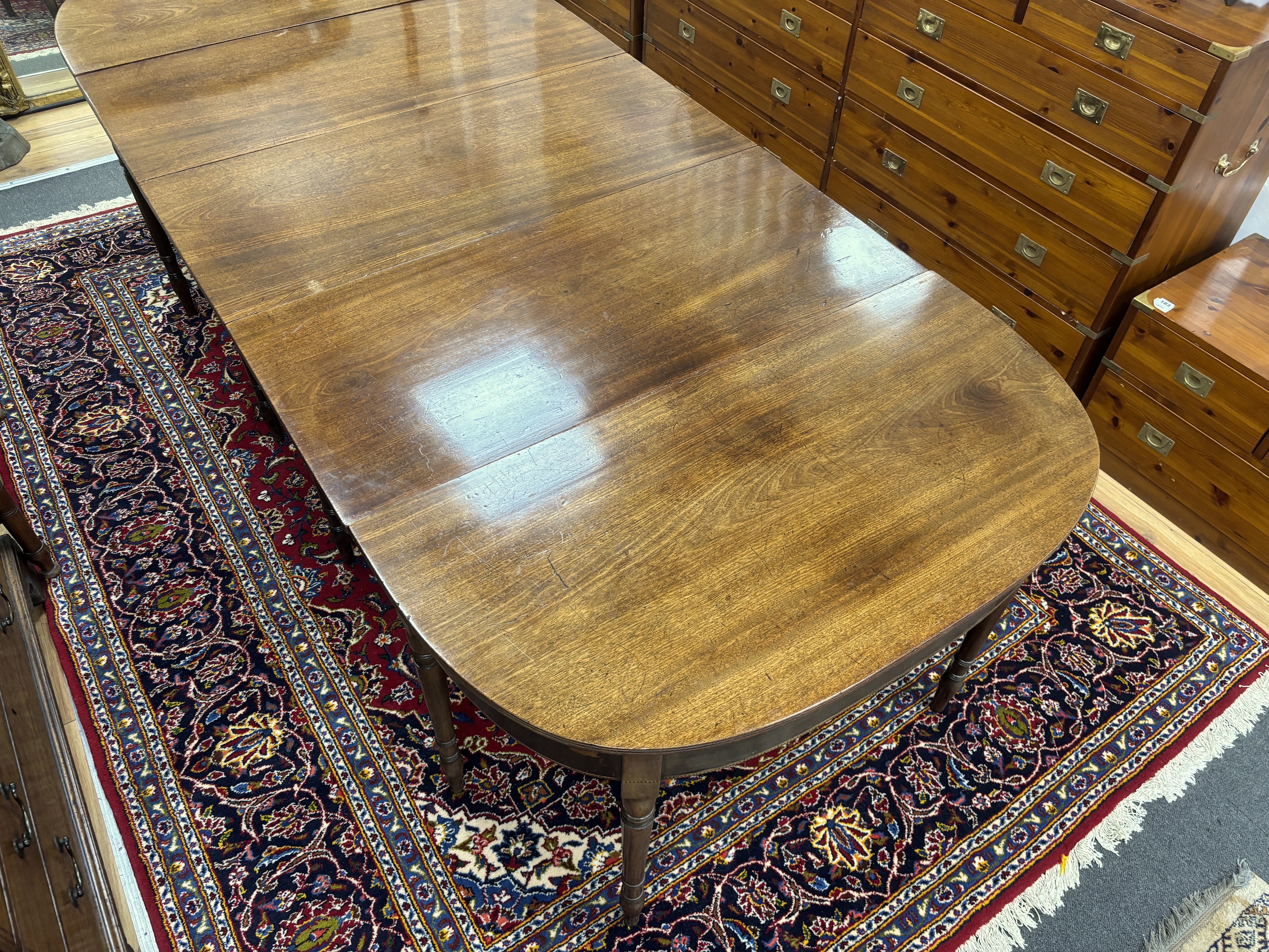 A Regency mahogany D end extending dining table, 257cm extended, width 109cm, height 70cm